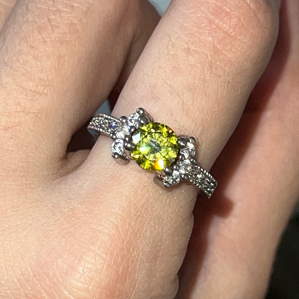 Elegant Silver and Yellow Gemstone Ring